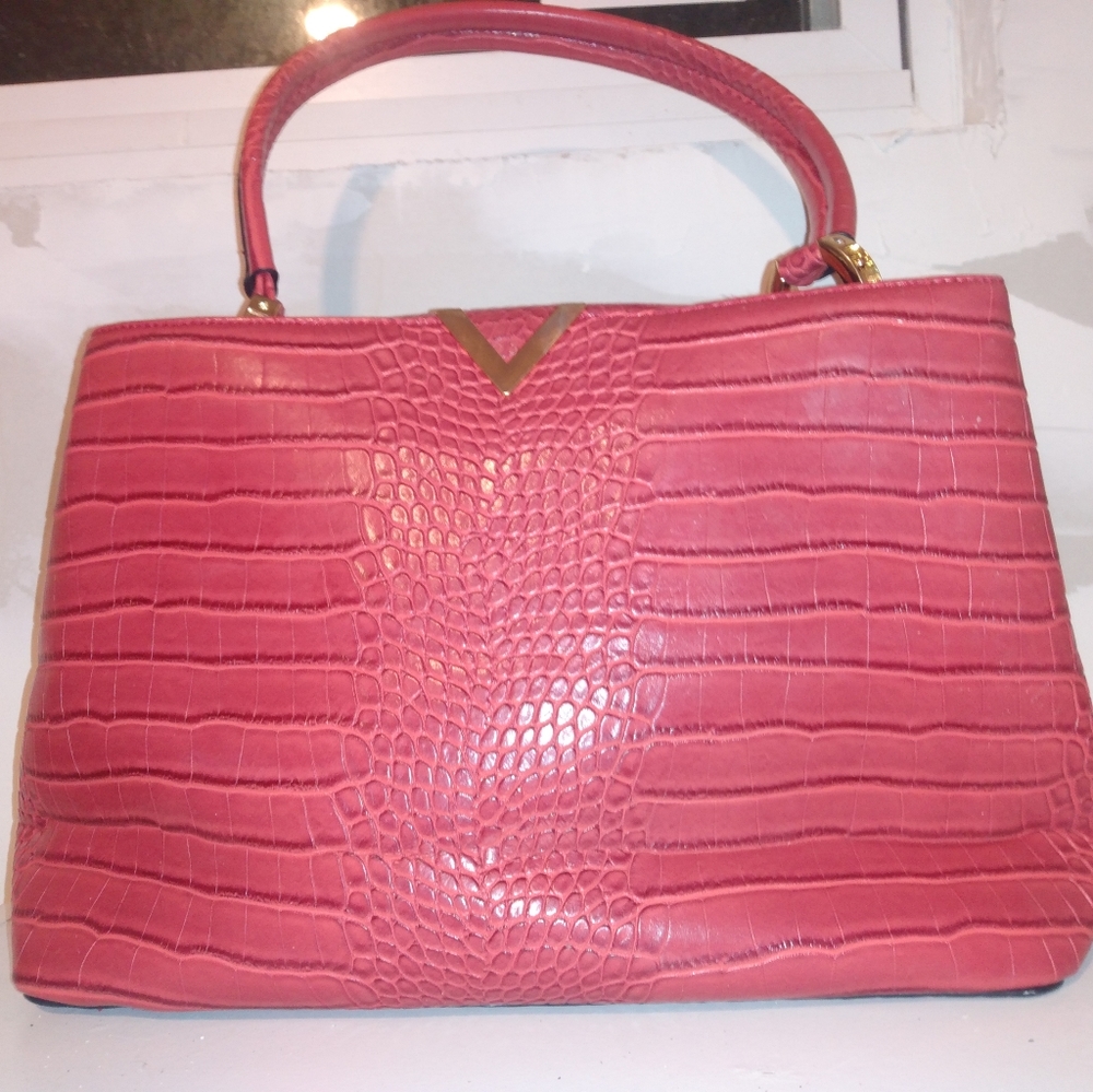 Red faux leather handbag